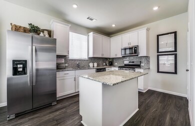 Island Kitchen *Photos of furnished model. Not act