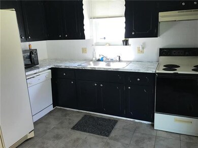Kitchen with painted cabinets.