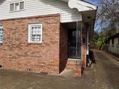 Triplex with front and rear off street parking