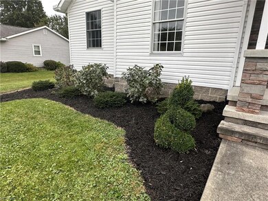 View of property featuring a yard