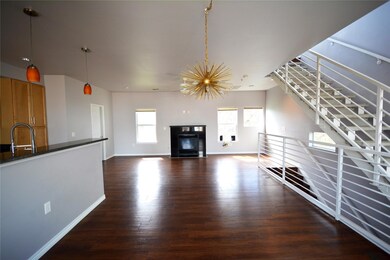 Unfurnished living room with baseboards, a notabl