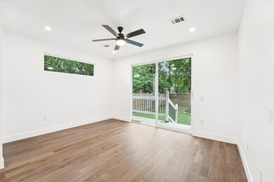 Spare room featuring wood finished floors, a ceil