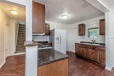 703 N Saint Clair Abrams Ave, Tavares, FL 32778 - photo 6