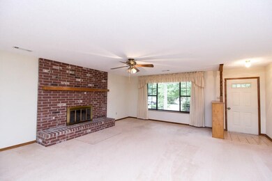 LIVING ROOM WITH BRICK GAS LOG FIREPLACE