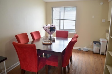 Dining space featuring wood finished floors