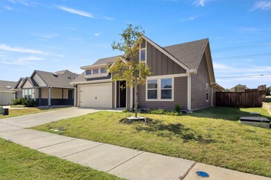 View of front of house featuring roof with shingles, board and batten siding, driveway, and a garage
