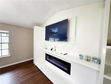 Unfurnished living room with a textured ceiling, b