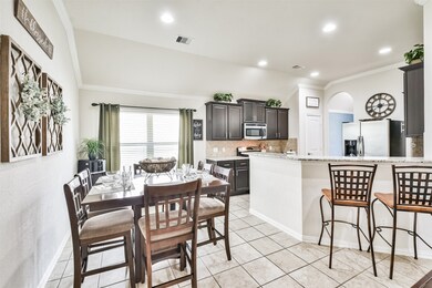 Dining area open to kitchen and family room
