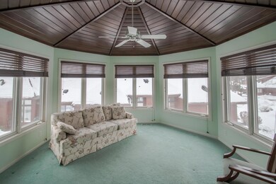 Sun porch with panoramic windows and beautiful tongue-and-groove ceiling