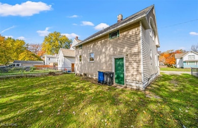 View of property exterior featuring a chimney
