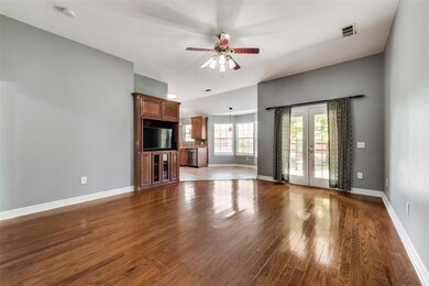 Enter this warm well maintained home with open floor plan and hardwood flooring