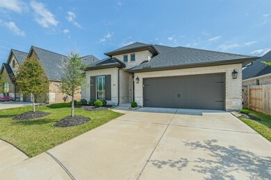 Double wide driveway with one large single overhead garage door.