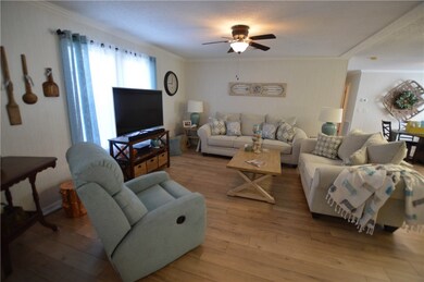 LIVING ROOM WITH VIEW OF DINING ROOM