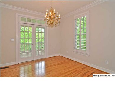 The dining room has French doors that open to a la