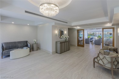 Building lobby with wallpapered walls and recessed lighting