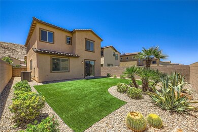 Rear view of property featuring stucco siding, a t
