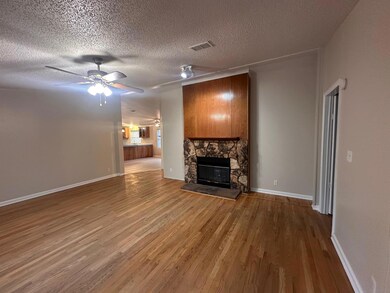 Unfurnished living room with wood finished floors