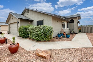 View of front of home featuring stucco siding, an