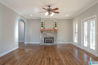 Offering wooded views, stacked stone fireplace & r