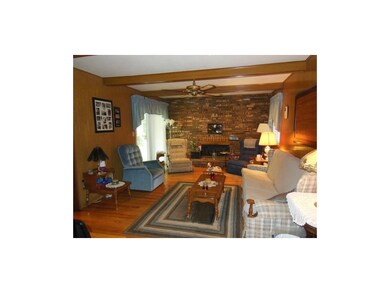 Family room with gas fireplace--wonderful hardwoods.