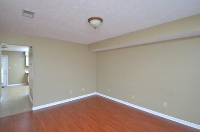 Living room with laminate flooring.