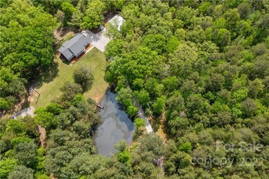 Home built in 2019 on 12.3 acres with a pond.