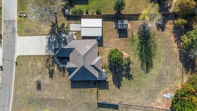 Aerial View to show the one acre fully fenced yard.