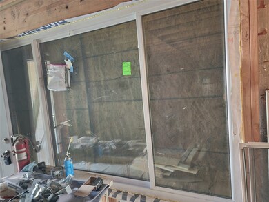 Giant picture window lights up the open concept li