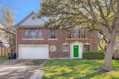 View of front facade featuring concrete driveway,