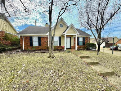 View of front of house with brick siding and a chi