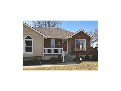 Covered Porch and Brick Accents.