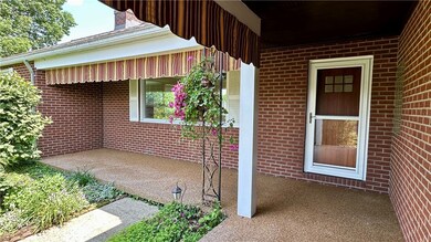 GORGEOUS L SHAPED FRONT COVERED PORCH WITH PEBBLE