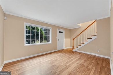 Foyer with light hardwood / wood-style floors and 