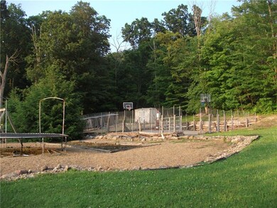 back yard play areas, basketball court surrounded 