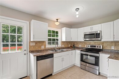 Kitchen featuring appliances with stainless steel
