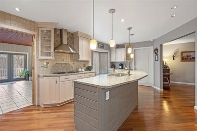 Spacious kitchen opens to BONUS room.