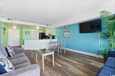 Living room with a textured ceiling and hardwood /