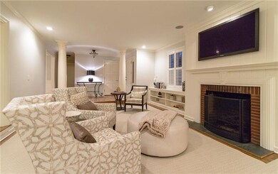 Big screen TV over log burning fireplace...built i
