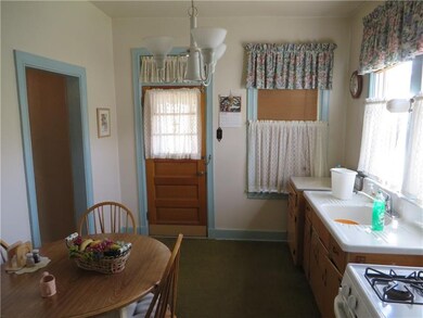 Another kitchen with door to yard
