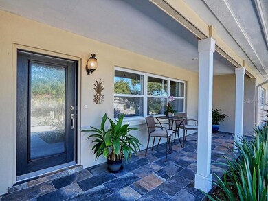 This modern new front door greets your guests and still gives you light, privacy and security! Note the new tile and new porch posts and newer windows all around!