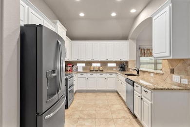Kitchen featuring stainless steel appliances, a s