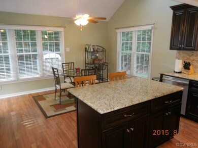 Eat-in kitchen with beautiful island, vaulted ceil