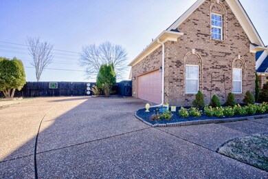 View of side of property with a garage