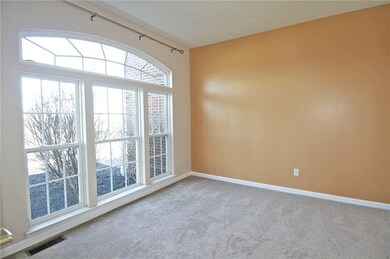 The den has glass French doors providing a quiet p