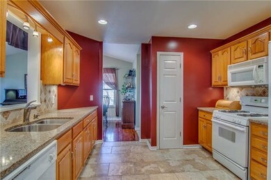 The Large Kitchen is Off  the Front Entry and has 