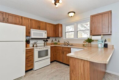 Bright Kitchen with large sunny window over kitche