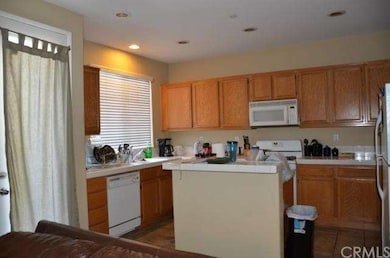 Kitchen with door leading to private patio.