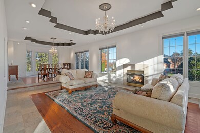 The living room opens to a formal dining room.