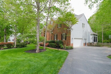 Paved driveway, side entry garage, fenced rear yar