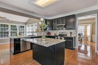Gorgeous updated kitchen surrounded by windows and